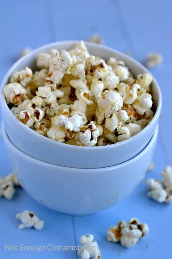 Homemade stovetop popcorn sprinkled with blue cheese and parmesan. To die for! - recipe on NotEnoughCinnamon.com