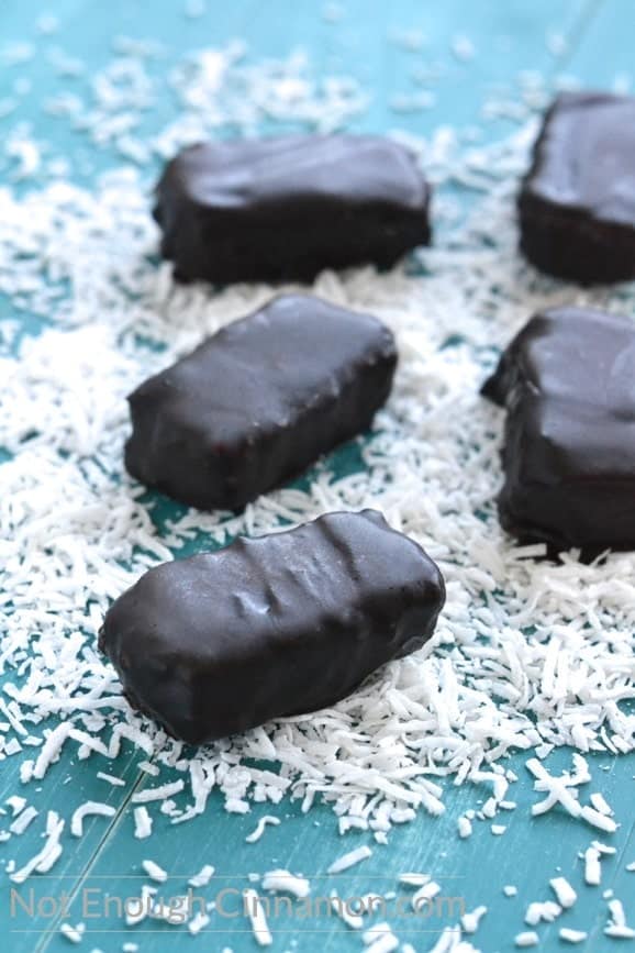side view of Easy Homemade Vegan and Paleo Bounty Bars covered in dark chocolate
