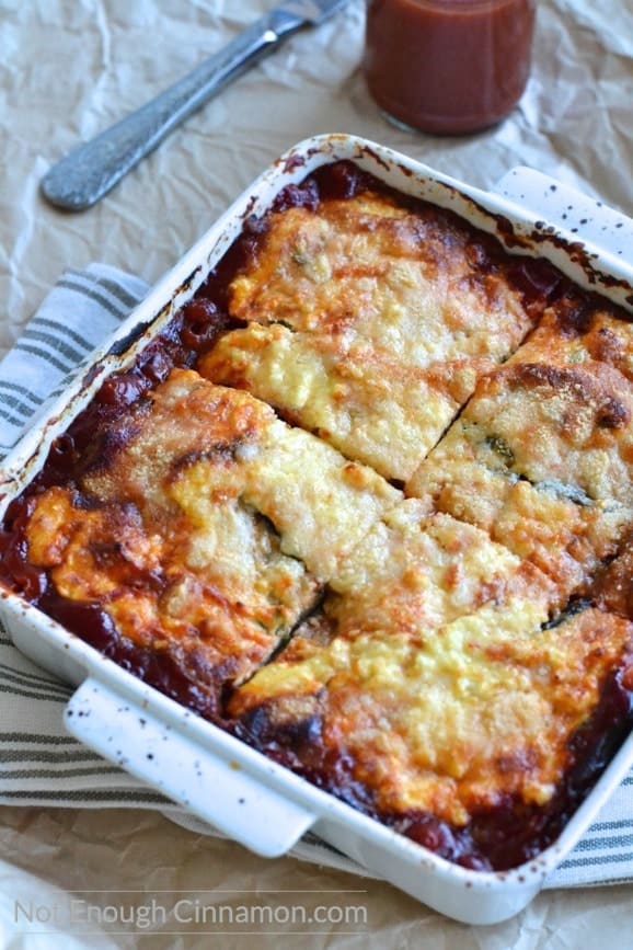 Perfect as a side dish or a meatless main dish, this Eggplant Ricotta Casserole is loaded with cheese and absolutely delicious! - Find the recipe on NotEnoughCinnamon.com #glutenfree #cleaneating