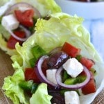 Greek Salad in Lettuce Cups - a fun take on this classic crowd pleaser salad. Find the recipe on NotEnoughCinnamon.com #healthy #glutenfree