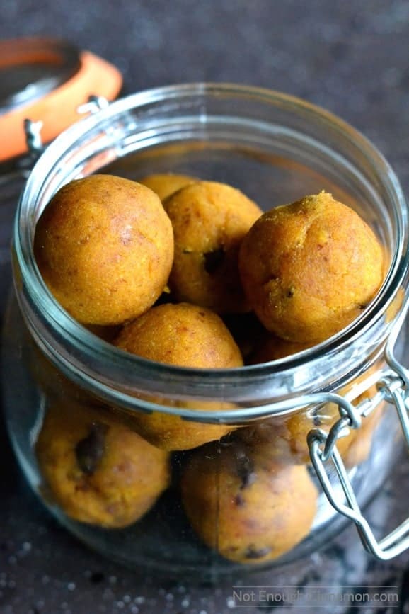 close up of a open mason jar filled with paleo pumpkin pie energy bites with chocolate chips