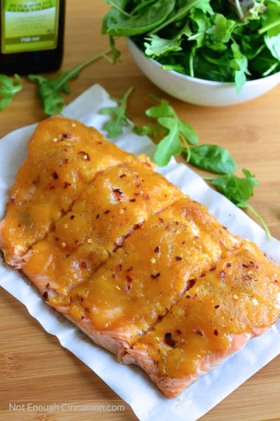 Baked salmon topped with a quick and easy mango jam. A great combination for a delicious and healthy dinner! | Find the recipe on NotEnoughCinnamon.com #glutenfree #paleo