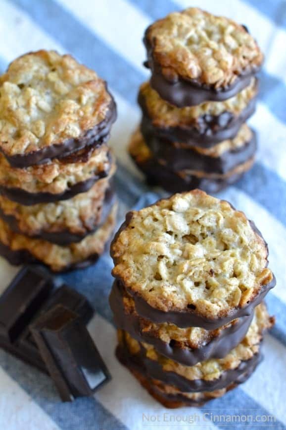 overhead shot of three stacks of Ikea Crispy Oatmeal Cookies with some dark chocolate squares on the side