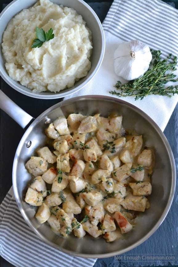 overhead shot of a pan with creamy maple mustard chicken with a side of dairy-free celeriac mash