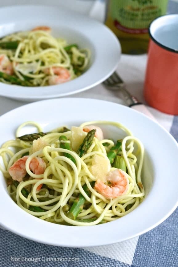 two bowls of Shrimp Zucchini Pasta made with zucchini noodles, asparagus, peas and shrimps