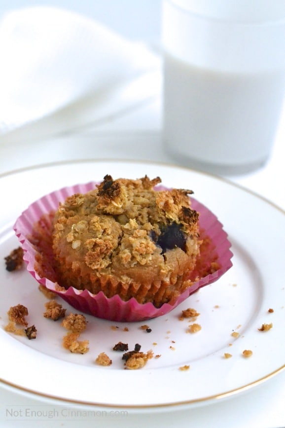 a healthy breakfast muffin with blueberries, apples and quinoa on a white plate