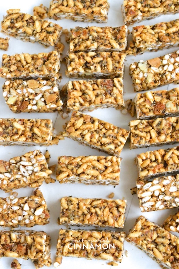 freshly cut homemade healthy peanut butter rice crispy treats arranged on a white surface