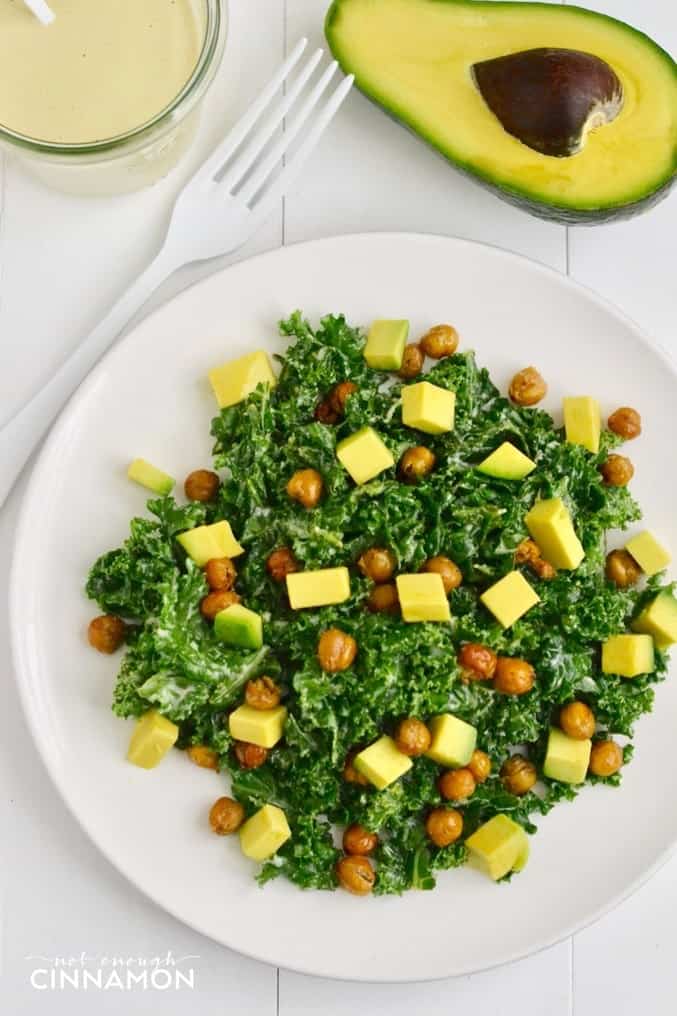 A nutritious Caesar kale salad made with avocado and crispy chickpeas (as croutons!) that tastes delicious! Dairy free and vegan! Find the recipe on NotEnoughCinnamon.com