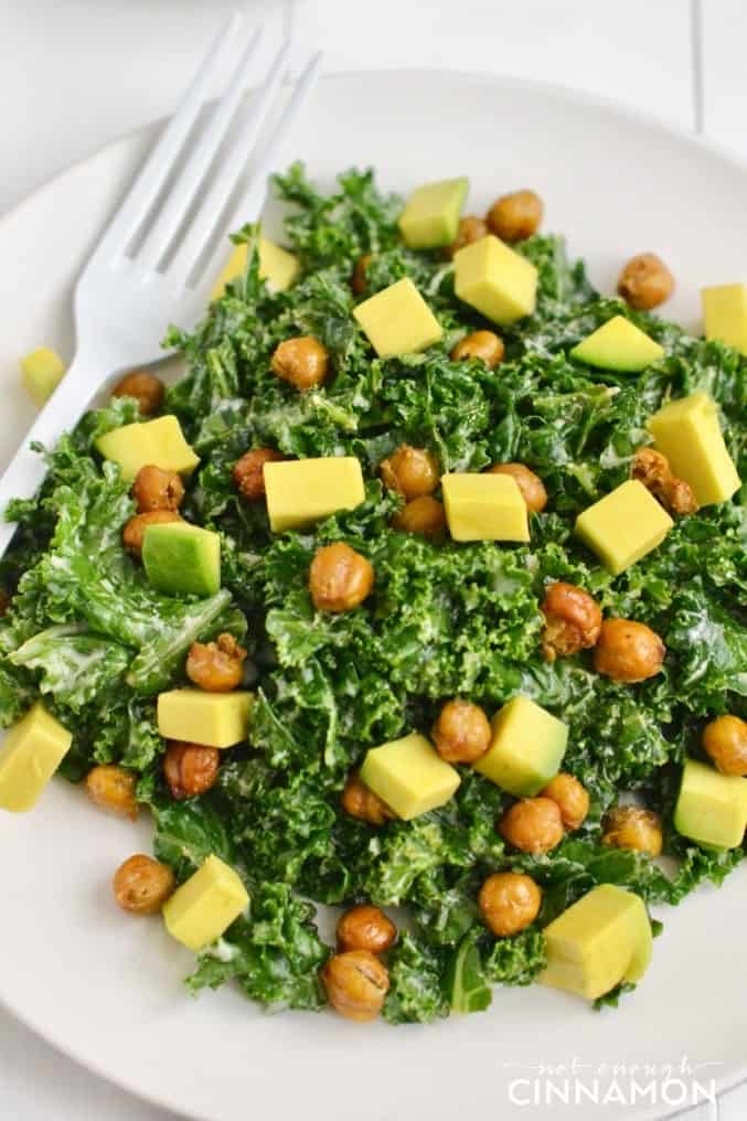 A nutritious Caesar kale salad made with avocado and crispy chickpeas (as croutons!) that tastes delicious! Dairy free and vegan! Find the recipe on NotEnoughCinnamon.com