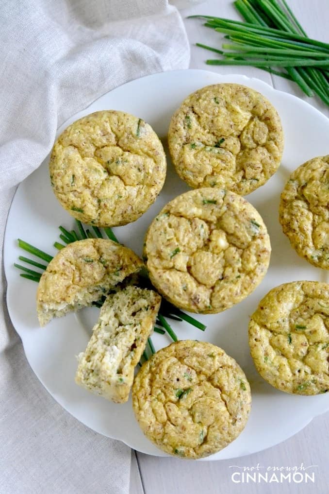 overhead shot of Gluten Free Zucchini Muffins with feta and chives on a white plate