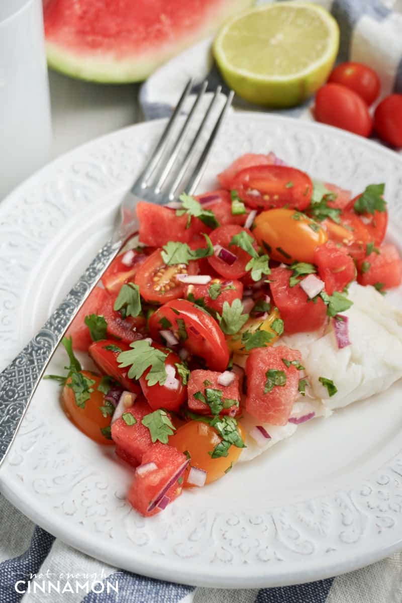 close-up of white Fish fillet covered with Chunky Tomato and Watermelon Salsa
