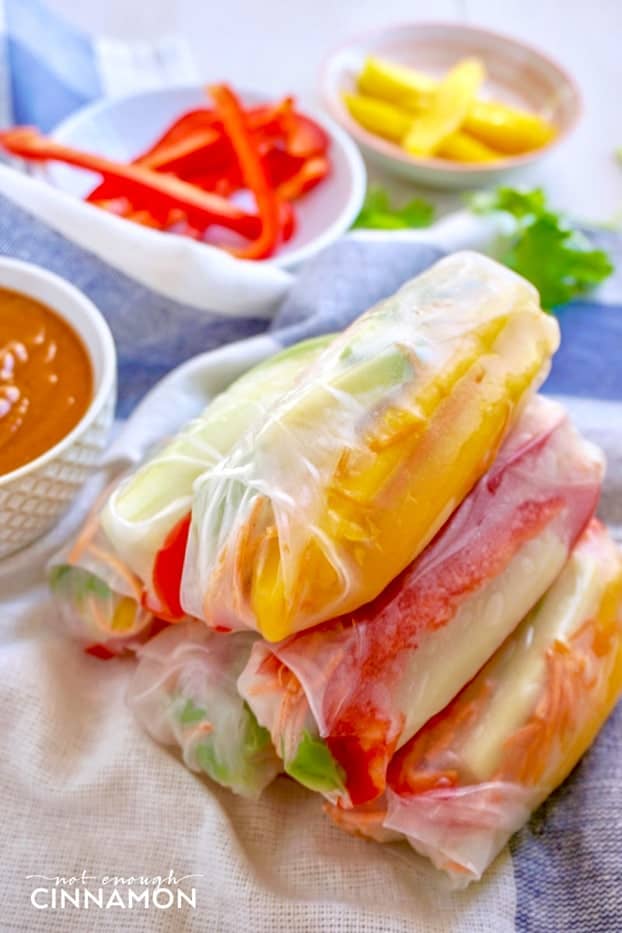 stacked Vegan Mango and Avocado Summer Rolls with a side dish of Peanut Sauce 