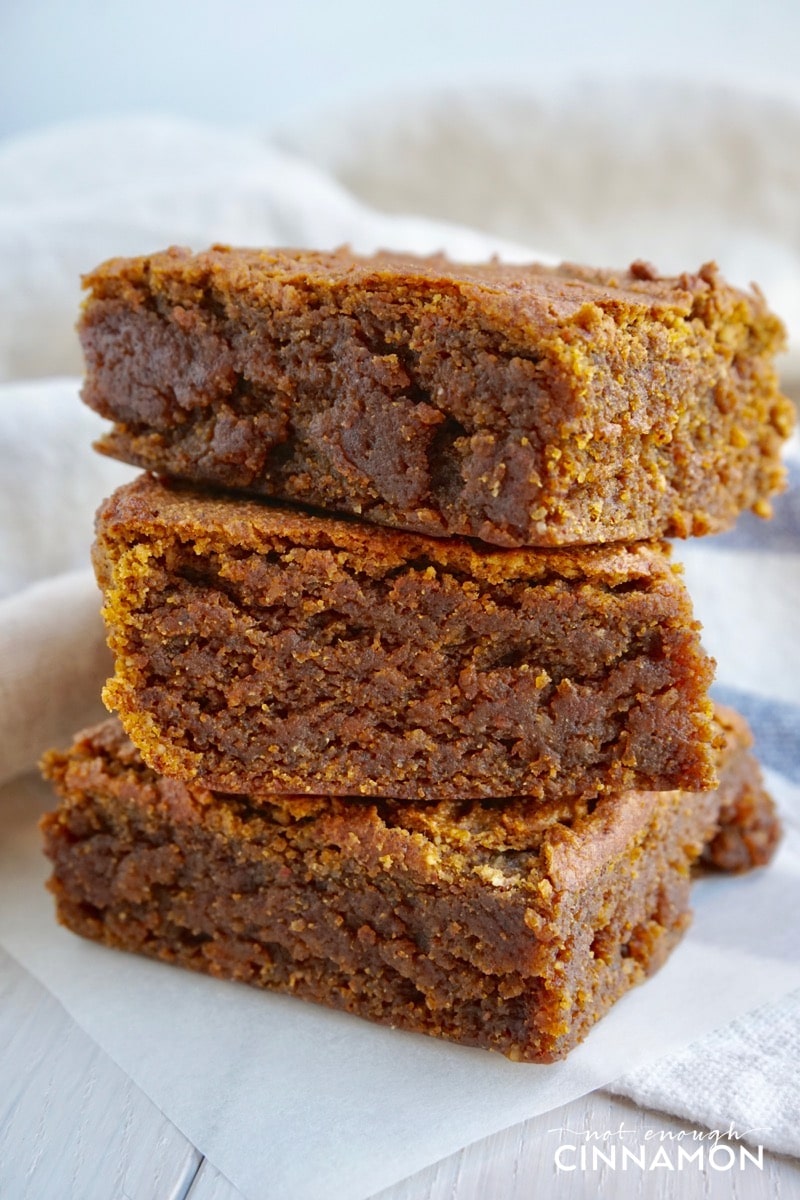 side view of a stack of moist and fudgey Vegan Paleo Pumpkin Spice Blondies 