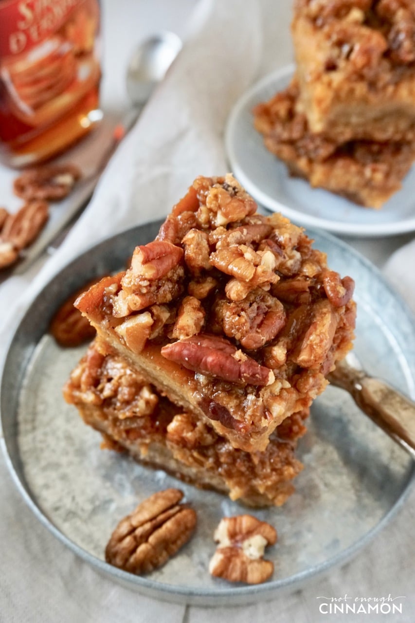 overhead shot of a stack of Healthy Pumpkin Pecan Bars on a metal plate