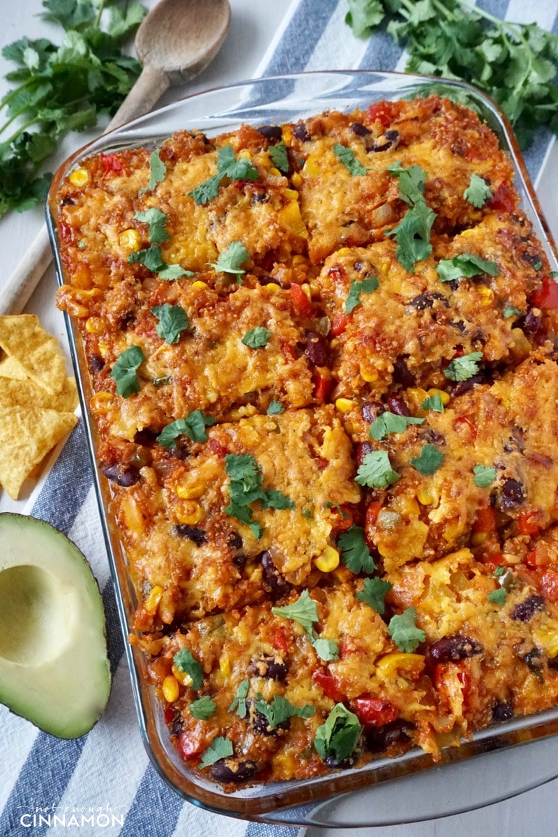 overhead shot of Mexican quinoa casserole in a glass dish sprinkled with cilantro leaves