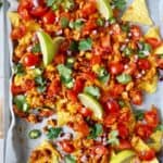 overhead shot of easy sheet pan nachos made with turkey and baked tortillas