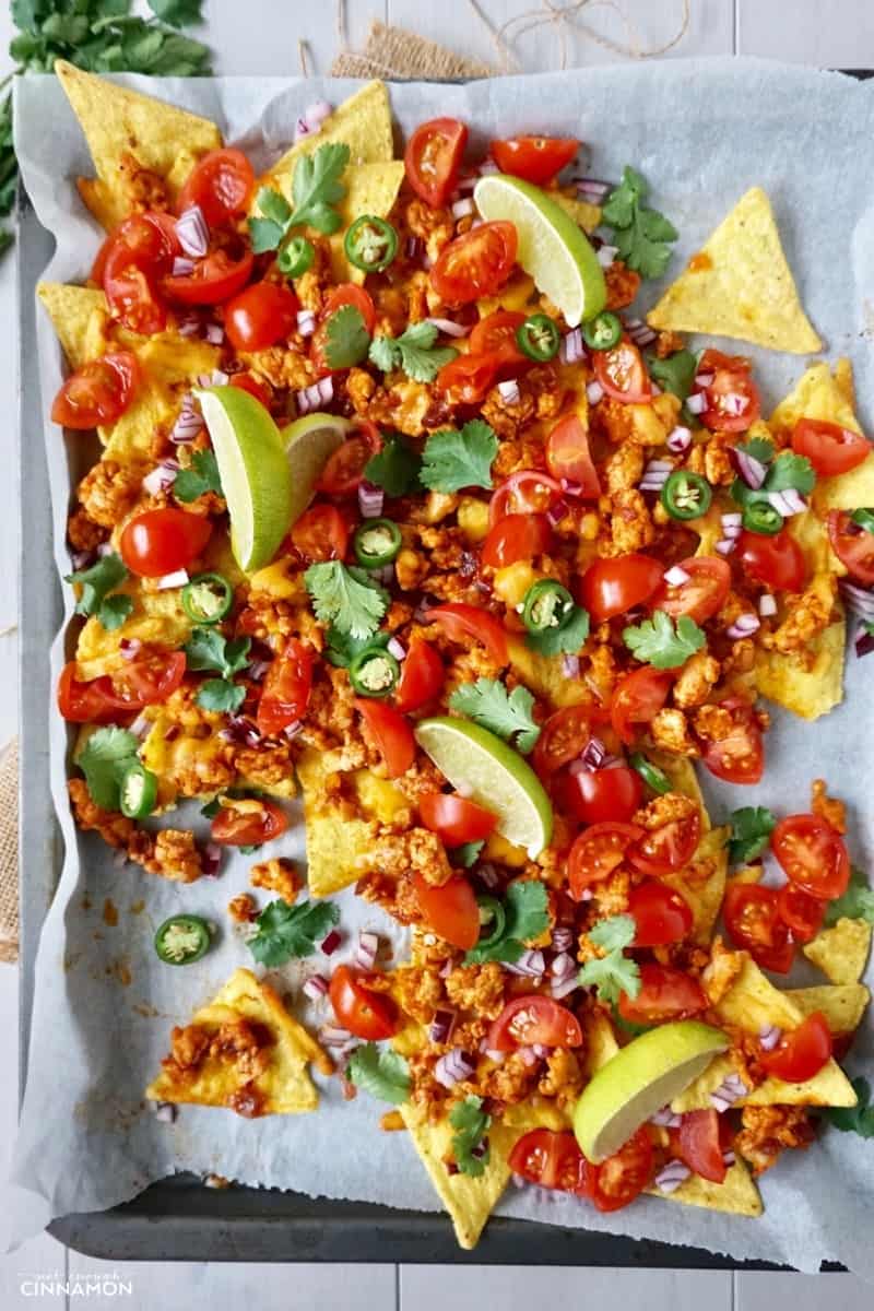 overhead shot of easy sheet pan nachos made with turkey and baked tortillas