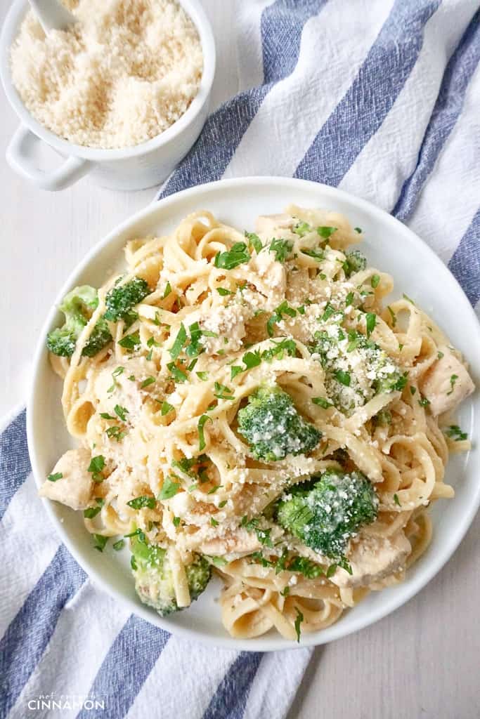 overhead shot of a plate of chicken and broccoli pasta with cauliflower Alfredo sauce