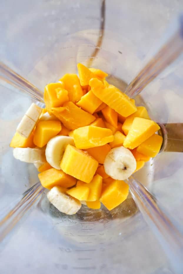 Frozen banana and mango in a blender