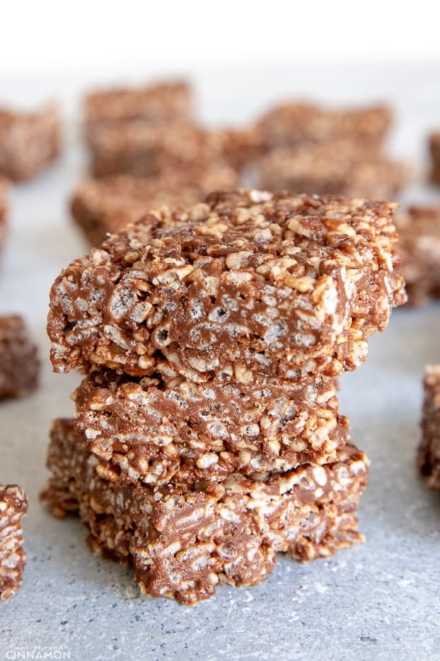 Three rice krispies treats squares with more in the background