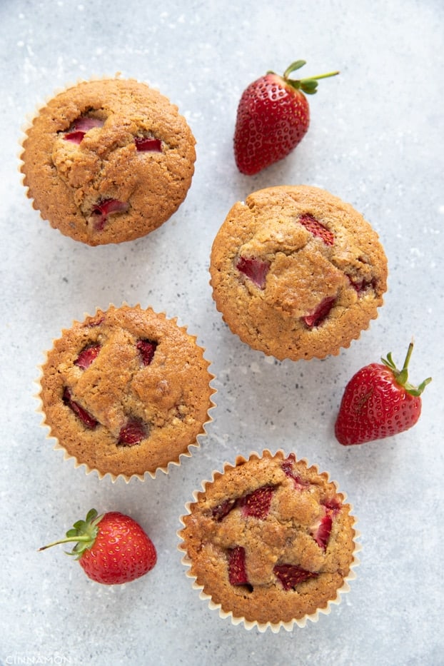 Overhead shot of four strawberry muffins