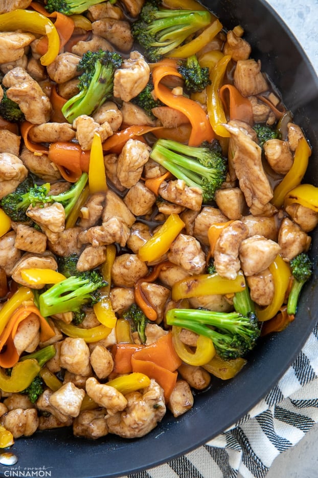 overhead shot of Paleo Chinese Restaurant-Style 5-Spice Chicken in a black skillet