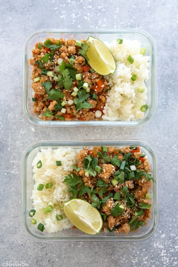 overhead shot of Asian Ground Turkey Rice Bowls served in two glass meal prep containers 