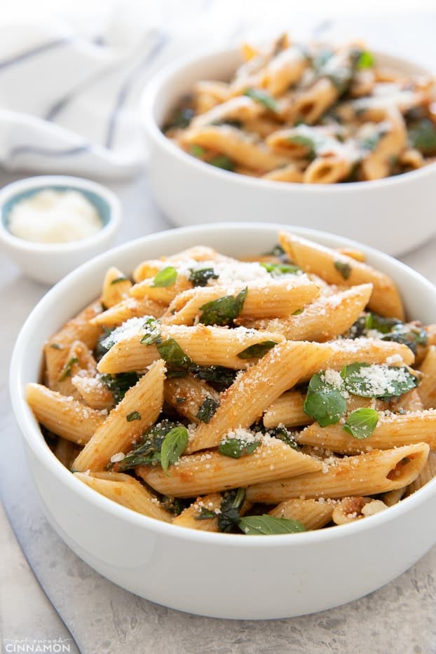 close-up side view of a bowl with penne pasta tossed in an easy sun-dried tomato sauce