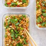 overhead shot of three glass containers with Asian Turkey Fried Rice