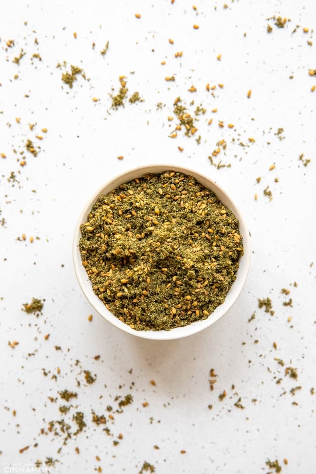 overhead shot of a small white dish with homemade za'atar spice blend