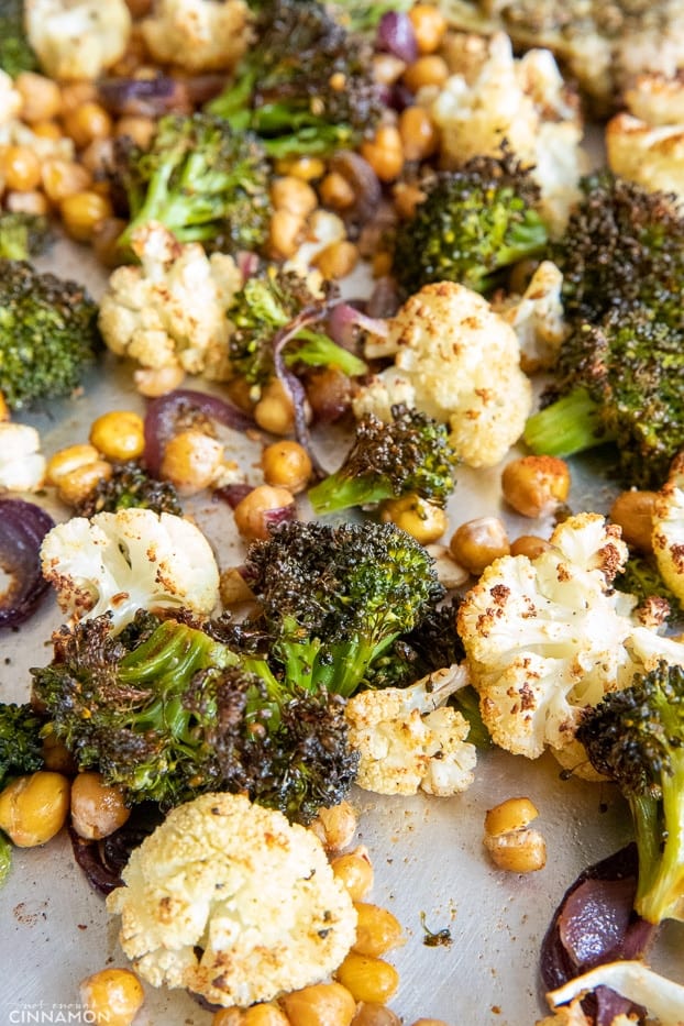 broccoli, cauliflower and chickpeas roasted until crispy and charred on a baking sheet