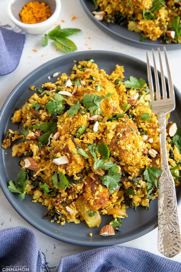 overhead shot of a plate with healthy paleo chicken biryani cauliflower rice stir-fry