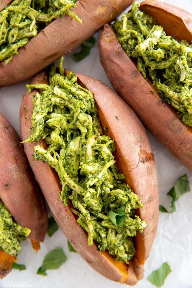 overhead shot of paleo pesto chicken stuffed baked sweet potatoes