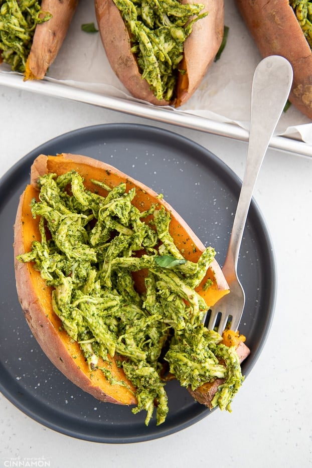 overhead shot of a stuffed sweet potato filled with pesto chicken