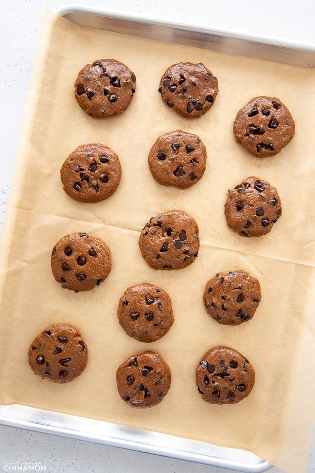 overhead shot of a tray on unbaked chocolate chip protein cookies made with whey protein powder