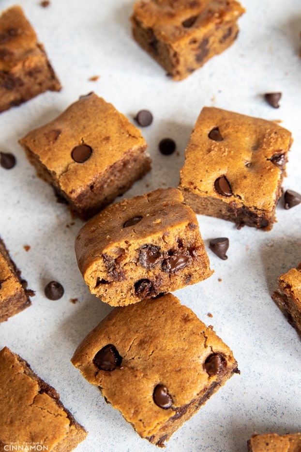 overhead shot of fudgy paleo almond butter blondies studded with dark chocolate chips 