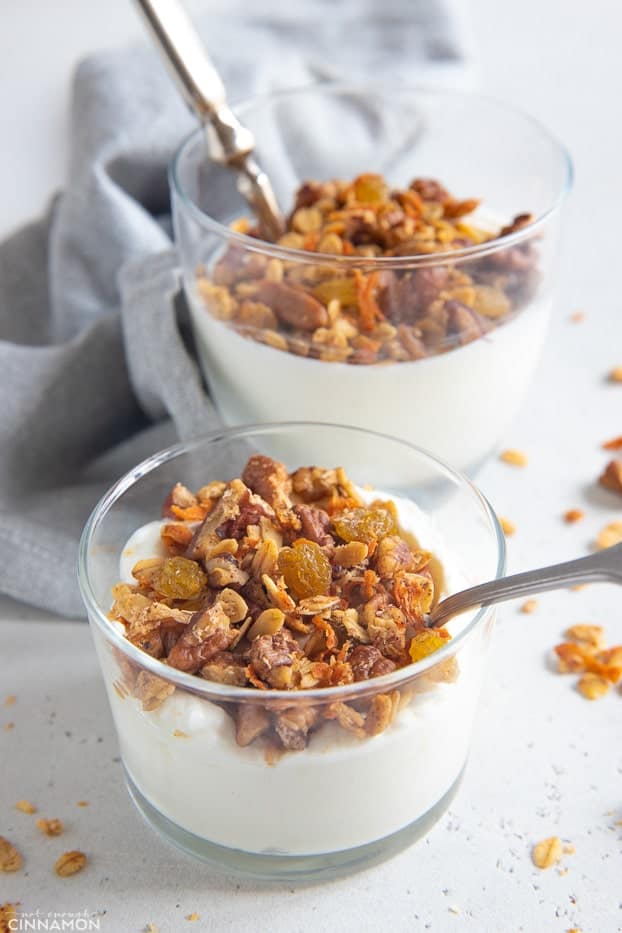 carrot cake granola served sprinkled on top of healthy Greek Yogurt