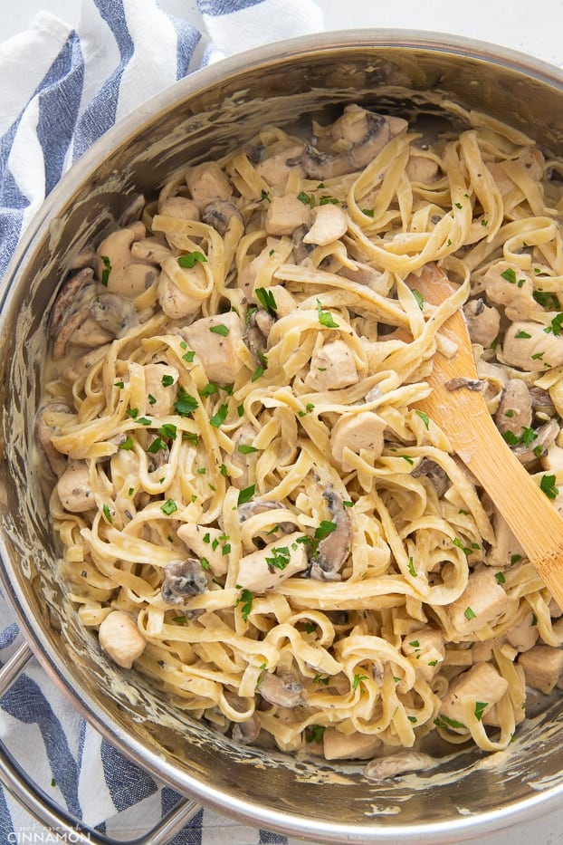 overhead shot of a pot of creamy Dairy-free Fettuccine Alfredo with Chicken and Mushrooms