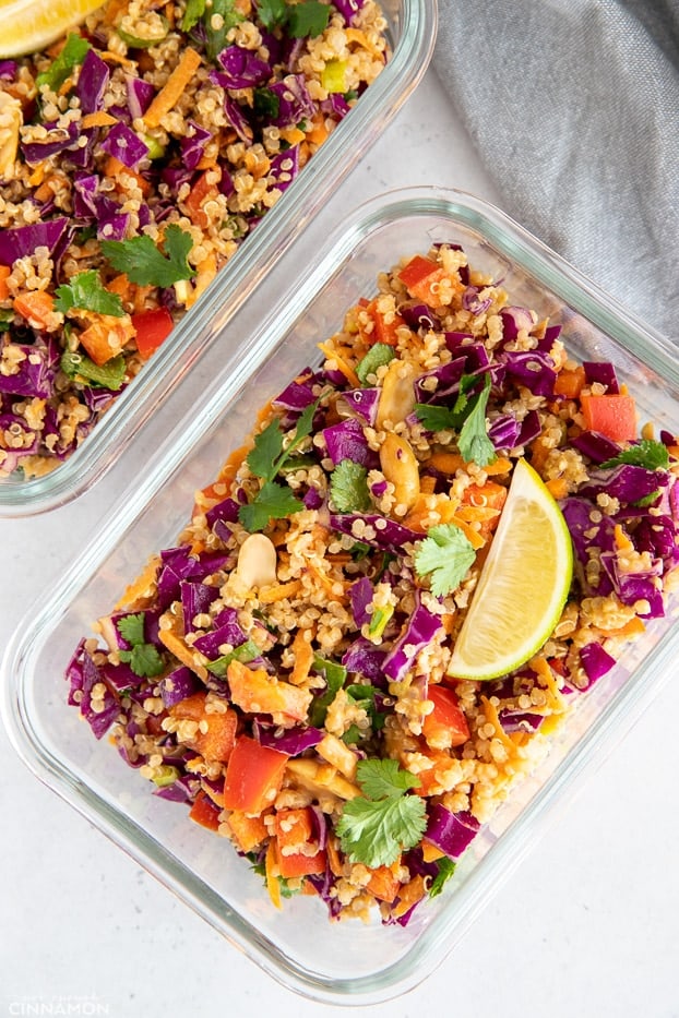 Thai Quinoa Salad with Creamy Asian Peanut Dressing packed into glass meal prep containers 