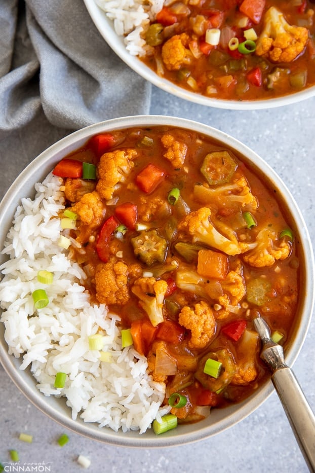 overhead shot of a bowl of vegan Louisiana gumbo with okra and cauliflower served with rice 