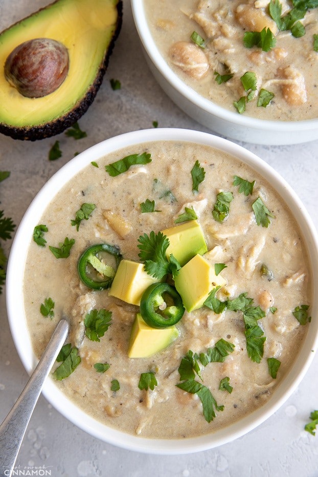 overhead shot of a bowl of slow cooker white chicken chili with white beans