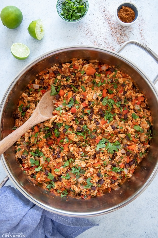 overhead shot of Mexican Fried Ground Turkey Rice in a pot sprinkled with cilantro 