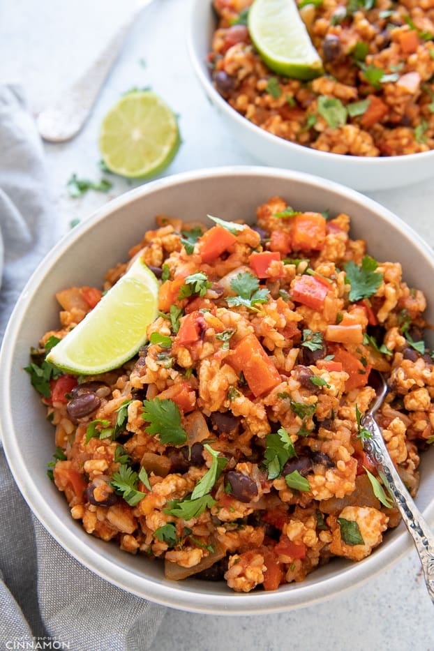 overhead shot of a serving of healthy Mexican Fried rice with ground turkey, topped with salsa and cilantro