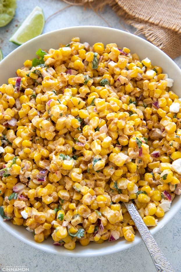 overhead shot of a bowl of Mexican Street Corn Salad with creamy cotija Greek Yogurt dressing