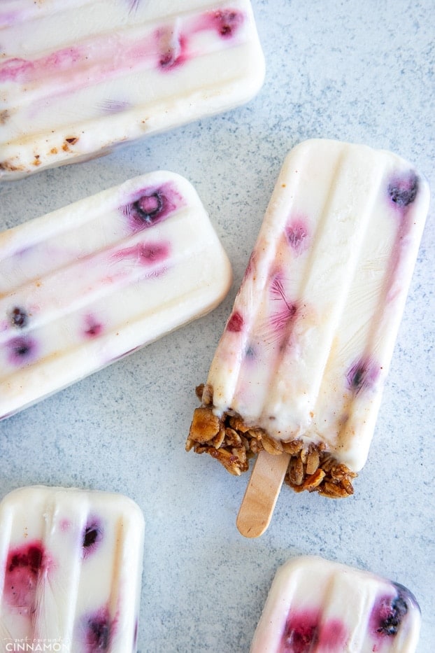 overhead shot of Greek Yogurt Popsicles with Berries and Granola