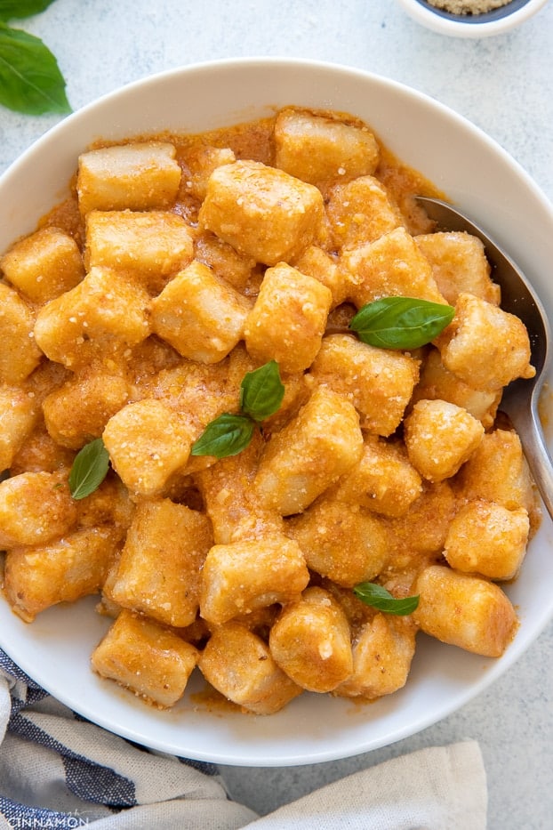 Homemade Copycat Trader Joe Cauliflower gnocchi served with creamy tomato sauce and basil