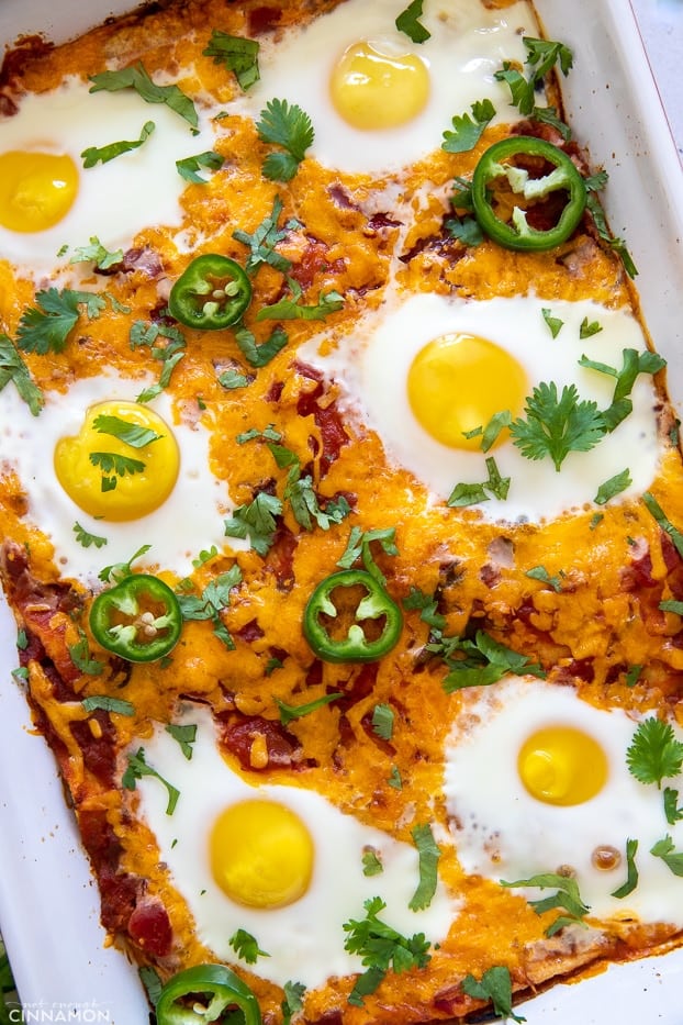 overhead shot of Mexican huevos rancheros casserole topped with baked eggs