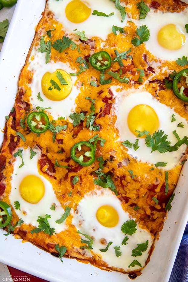 Mexican huevos rancheros casserole topped with baked eggs 