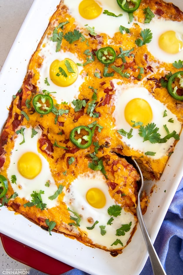 overhead shot of a healthy Mexican huevos rancheros casserole with a spoon