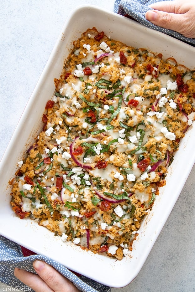 overhead shot of quinoa casserole with feta and pesto